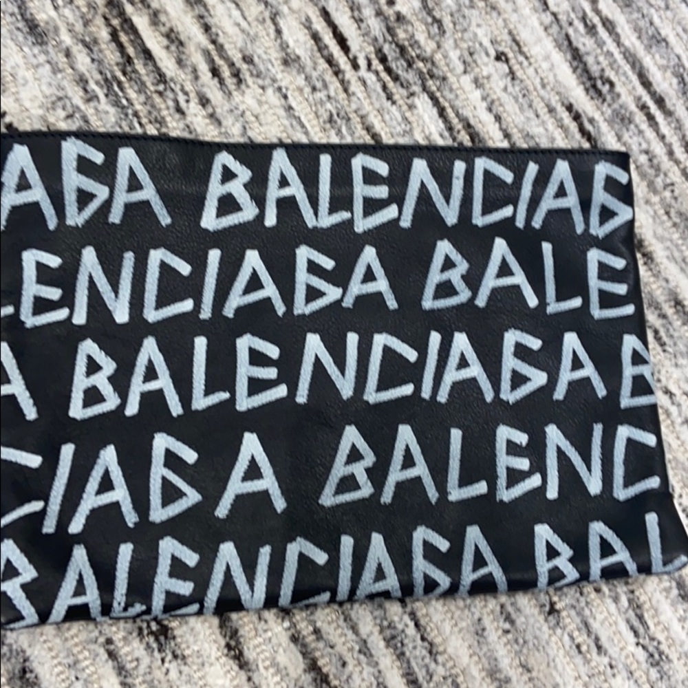 All over Balenciaga clutch